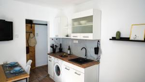 Dapur atau dapur kecil di BOM apartman