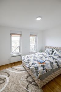 Ένα ή περισσότερα κρεβάτια σε δωμάτιο στο Apartman STEFAN