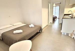 Ένα ή περισσότερα κρεβάτια σε δωμάτιο στο Sunset Rooms & Apartments