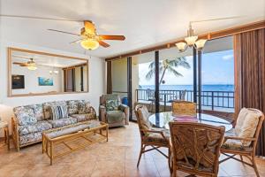 a living room with a couch and a table at Sugar Beach Resort, #524 in Kihei +30 photos