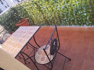 a table and a grill on a patio at I fiori in Bibbiena