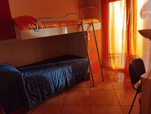 a room with two bunk beds in a room at I fiori in Bibbiena