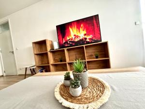 TV a/nebo společenská místnost v ubytování Sweet Home