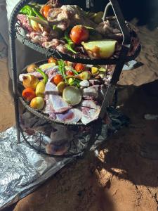 two baskets filled with different types of fruits and vegetables at Bubbles Desert Camp Jeep Tours in Disah