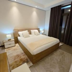 Ένα ή περισσότερα κρεβάτια σε δωμάτιο στο Gracey Concierge Apartments - Avenue Uvira