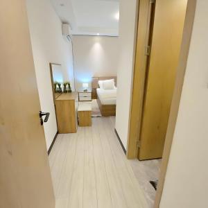 Ένα ή περισσότερα κρεβάτια σε δωμάτιο στο Gracey Concierge Apartments - Avenue Uvira