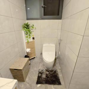 Ένα μπάνιο στο Gracey Concierge Apartments - Avenue Uvira