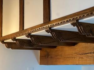 a close up of a wooden beam in a ceiling at Apartamentos Villa Julieta in Ruente