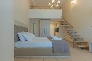 Posteľ alebo postele v izbe v ubytovaní Fani Luxury Apartments Stavros