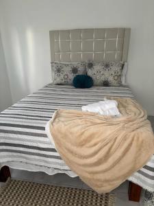 Postel nebo postele na pokoji v ubytování Paradise Palm Villa