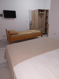 Postel nebo postele na pokoji v ubytování Vila REJANA