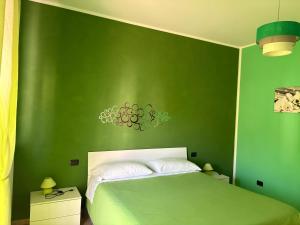 A bed or beds in a room at Color House Malpensa B&B