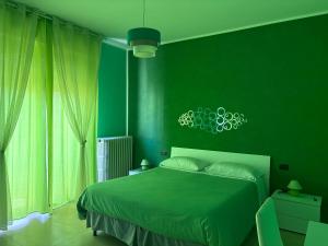 A bed or beds in a room at Color House Malpensa B&B