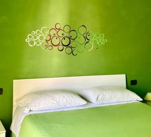A bed or beds in a room at Color House Malpensa B&B