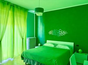 A bed or beds in a room at Color House Malpensa B&B