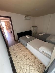 Postel nebo postele na pokoji v ubytování Apartamento para até 6 pessoas - Orla da Praia Grande + 11 fotografií