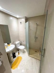 a bathroom with a shower and a toilet and a sink at luxury Aprt2 bedrooms Pool hivernage heart of city in Marrakech