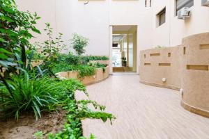 a hallway of a building with plants at luxury Aprt2 bedrooms Pool hivernage heart of city in Marrakech