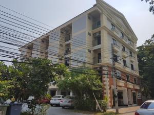 a building with cars parked in front of it at The European Place in Bangkok