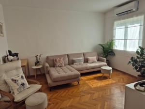 a living room with a couch and a chair at Zlatna Boska in Kotor