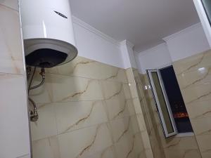 a bathroom with a shower and a window at 3 rooms apartment in vlora in Vlorë +13 photos