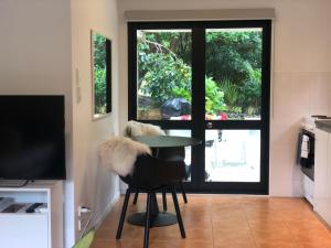 TV a/nebo společenská místnost v ubytování Villetta - Matakana Country Escape