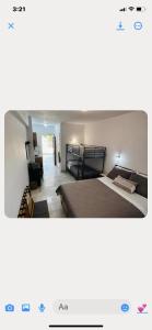 two pictures of a bedroom with a bed at Studio Saroukos in Kalymnos