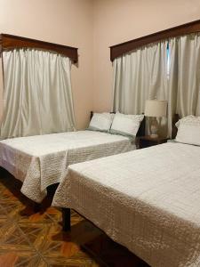 Postelja oz. postelje v sobi nastanitve Hostal Marias