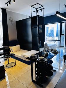 a room with a bed and a table in it at The Axon Suites Pro Max in Kuala Lumpur +113 photos