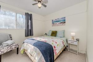 a bedroom with a bed and a ceiling fan at Affordable Sauble Beach Getaway in Sauble Beach