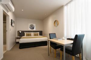 Postel nebo postele na pokoji v ubytování Quest on Hobson Serviced Apartments