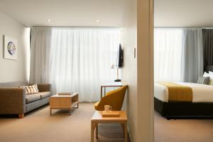 Postel nebo postele na pokoji v ubytování Quest on Hobson Serviced Apartments