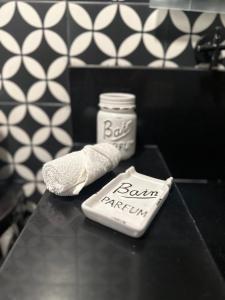 a bottle of milk and a toothbrush on a table at Santa Noche Suite & Spa in San Miguel de Allende +55 photos