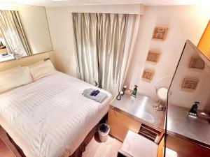 Postel nebo postele na pokoji v ubytování EN Hotel Shibuya