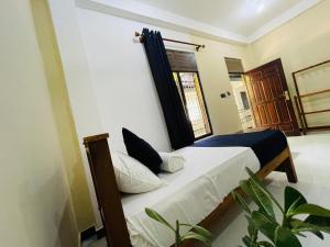 Voodi või voodid majutusasutuse Natraj Guest House toas