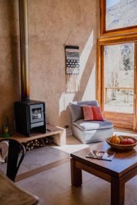 Posezení v ubytování Piuquenes Lodge - Cabañas, Viñedos y estrellas en Horcón, Valle de Elqui