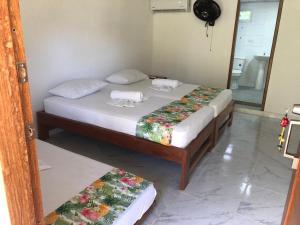 Postel nebo postele na pokoji v ubytování Hotel Nuquimar
