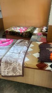 Ένα ή περισσότερα κρεβάτια σε δωμάτιο στο Sunface Homestay