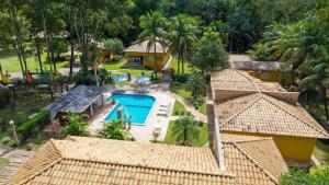 an aerial view of a house with a swimming pool at Recanto 3ELLL in Bodoquena