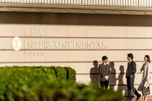 a group of people walking in front of a building at ANA InterContinental Tokyo by IHG in Tokyo