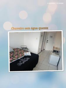 Ένα ή περισσότερα κρεβάτια σε δωμάτιο στο Silva Hospedagem FLAT BELLAGIO BEIRA MAR