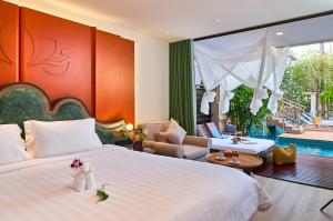 Postel nebo postele na pokoji v ubytování Burasari Phuket Resort & Spa + 37 fotografií