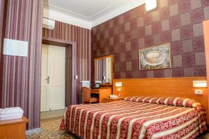 Postel nebo postele na pokoji v ubytování Hotel Emmaus