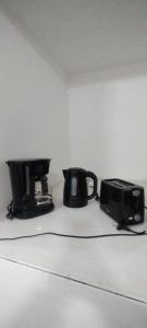 a toaster and a radio sitting on a counter at Dulce Adelina III - Zona Céntrica in Río Grande