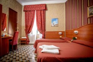 Postel nebo postele na pokoji v ubytování Hotel Emmaus