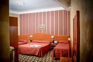 Postel nebo postele na pokoji v ubytování Hotel Emmaus