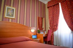 Postel nebo postele na pokoji v ubytování Hotel Emmaus