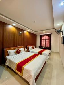 Postel nebo postele na pokoji v ubytování Gia Nguyen Hotel Vung Tau