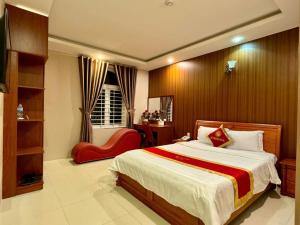 Postel nebo postele na pokoji v ubytování Gia Nguyen Hotel Vung Tau