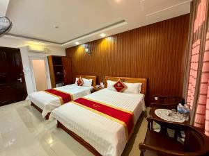 Postel nebo postele na pokoji v ubytování Gia Nguyen Hotel Vung Tau